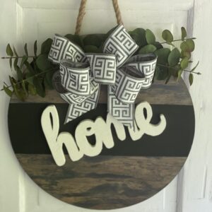 3-D home on a round wood sign