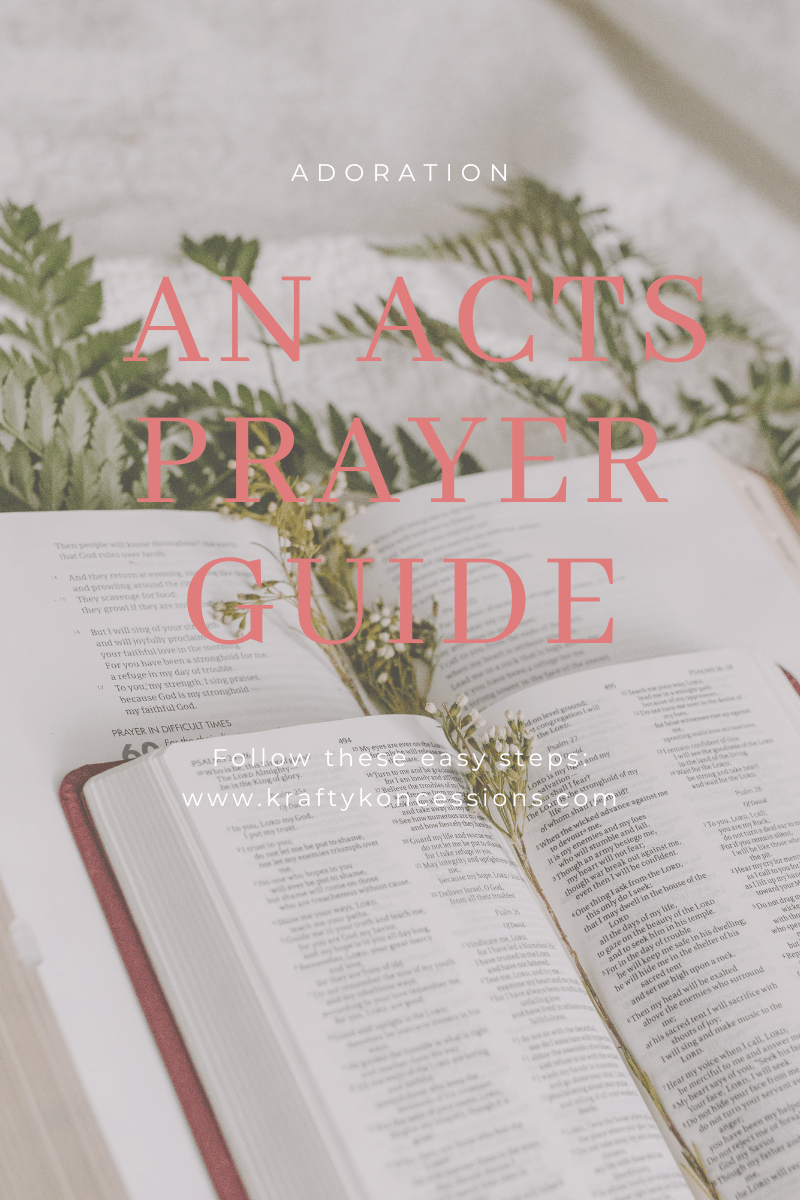 An open Bible with a journal for writing ACTS prayers.