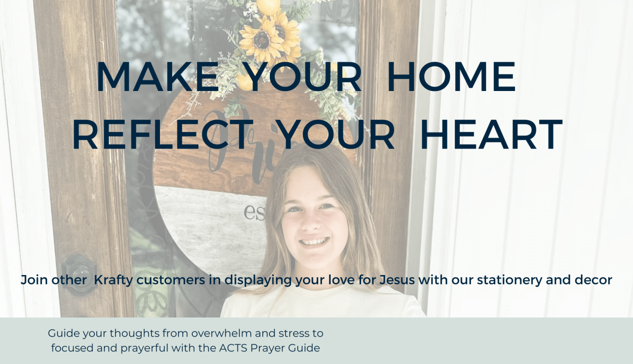 Girl wearing a white t-shirt with a black and gold JC logo in front of a Krafty Koncessions brown and white name 7 est. sign.